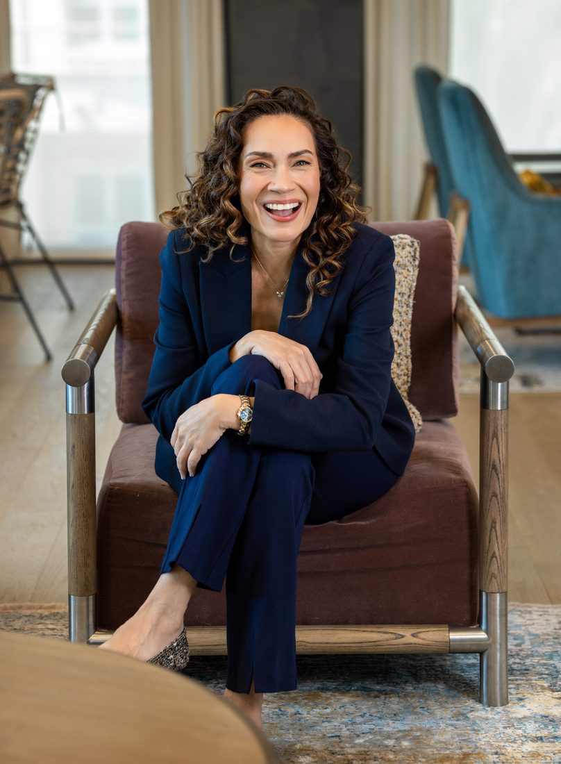 Personal branding portrait of a woman in a navy suit