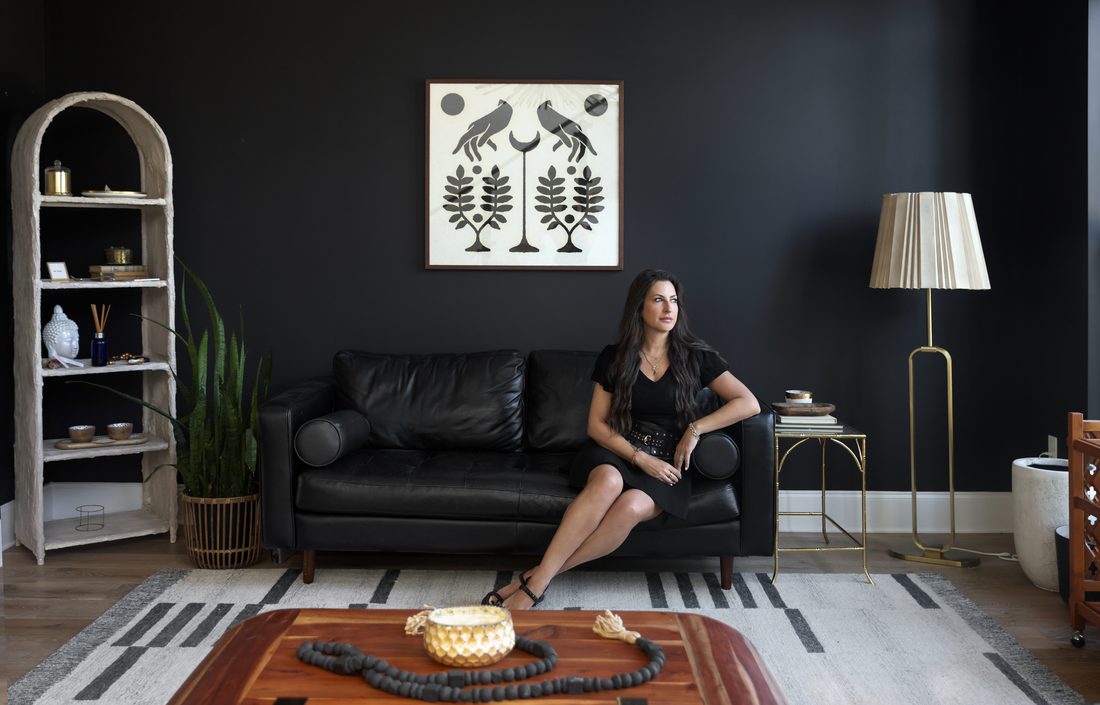 Personal branding portrait in a moody living room