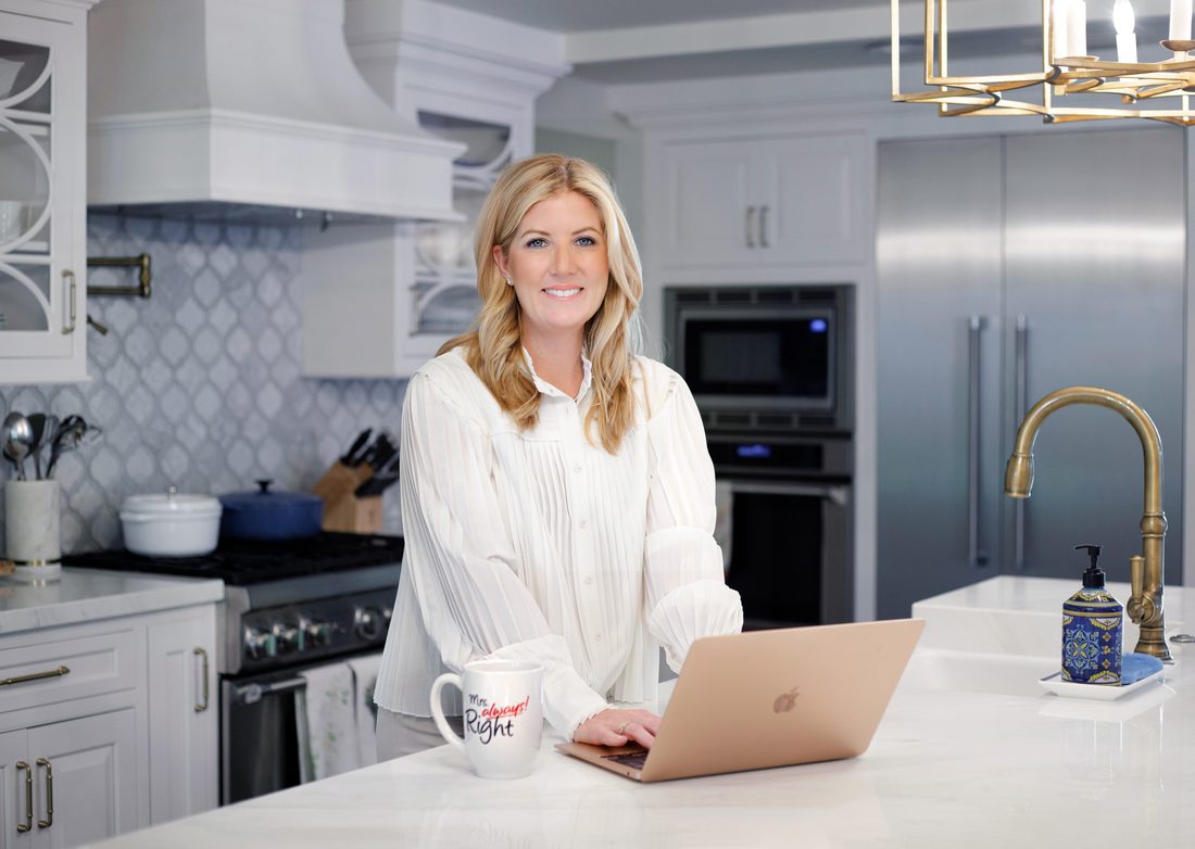 Personal branding portrait of a woman working in her kitchen