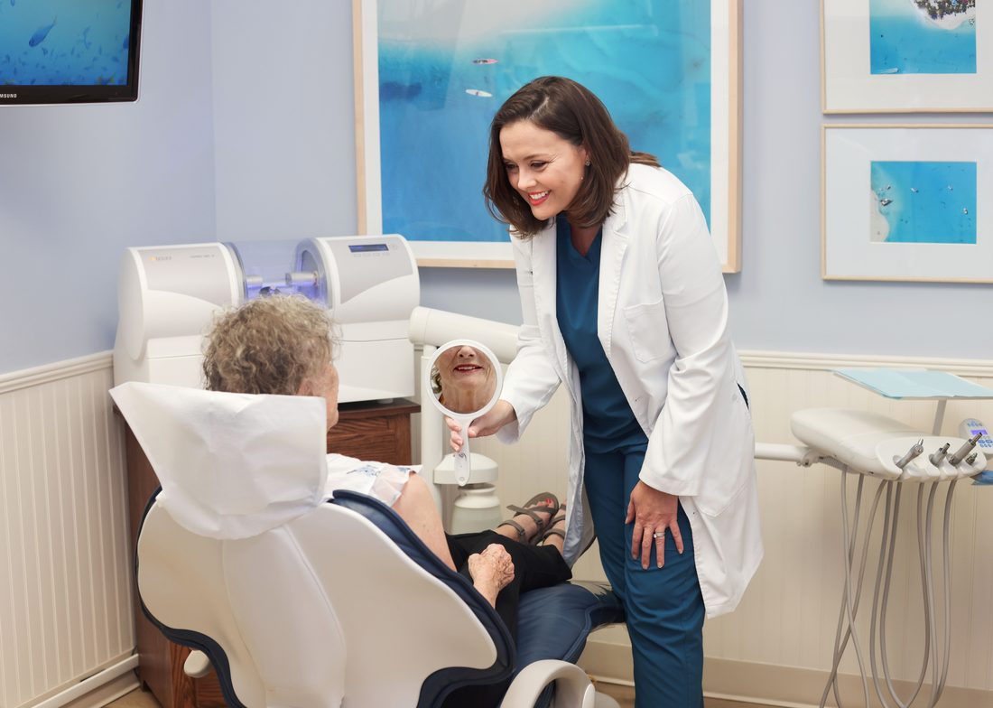 Dental office team portrait with a patient