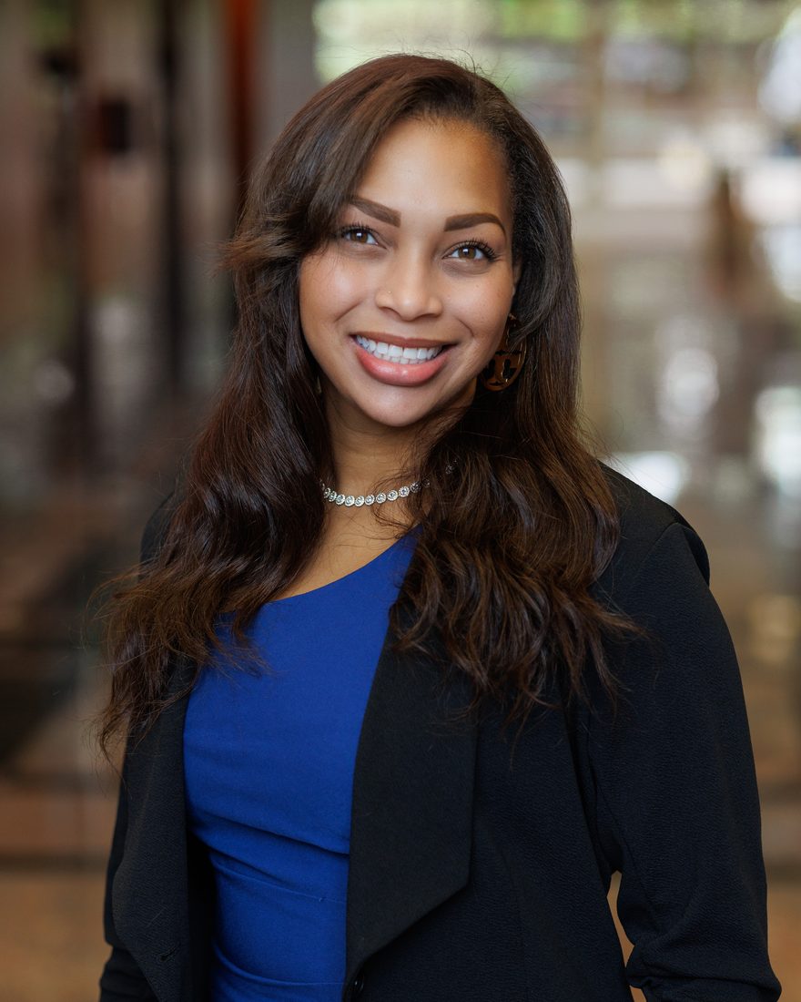 Business headshot of a woman in a blue top