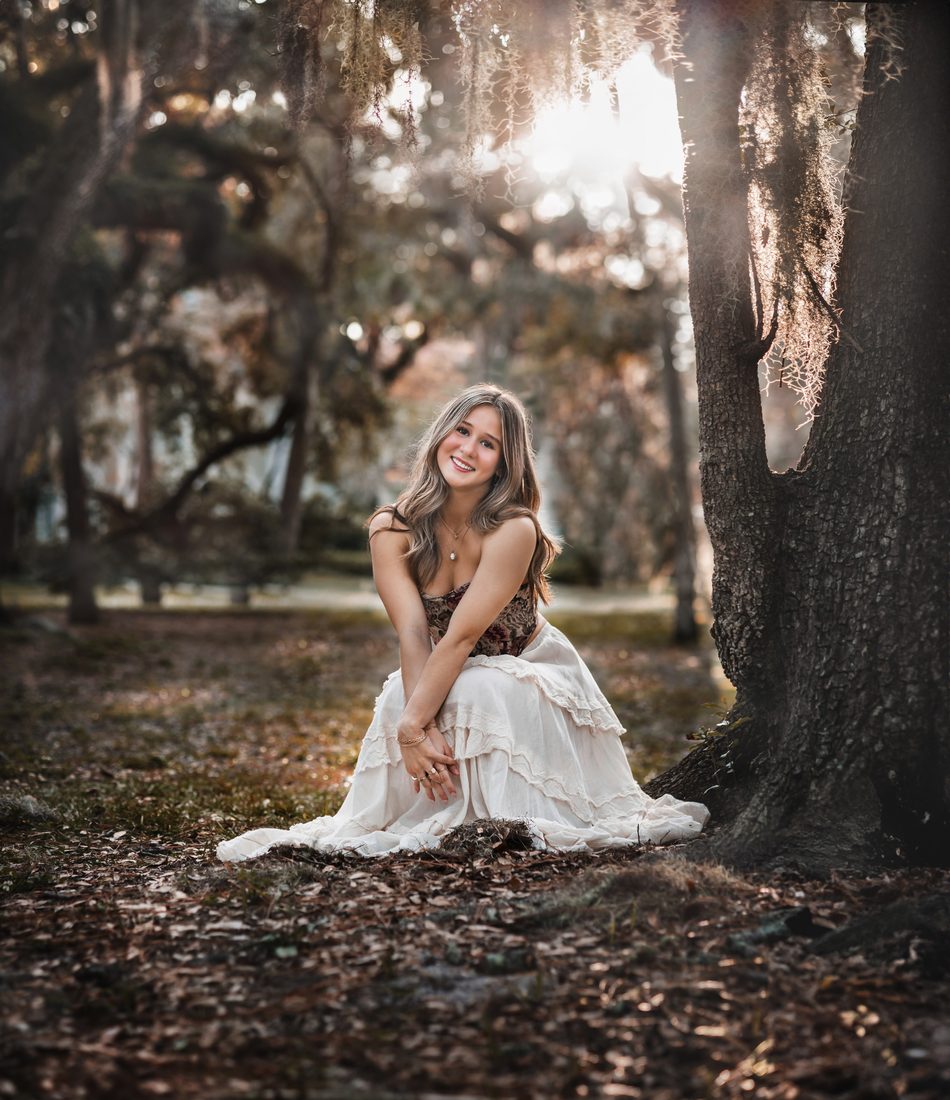 Senior portrait under an oak tree
