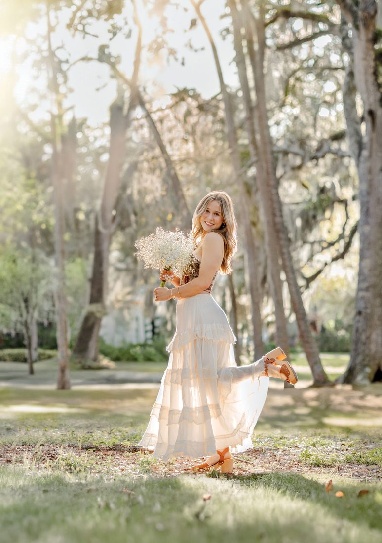 Senior portrait with a baby's breath bouquet
