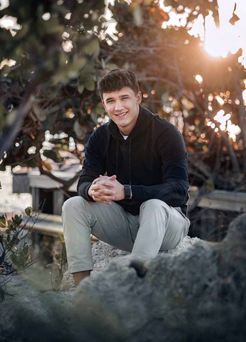 Senior portrait outdoors at sunset